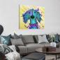 Preview: Bild von Hund Toosie. Das Bild hängt an einer Wand davor steht ein großes graues Sofa mit vielen grauen und türkisen Sofakissen